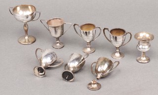 A silver twin handled trophy cup Birmingham 1929 8cm and 8 others, 126g gross 