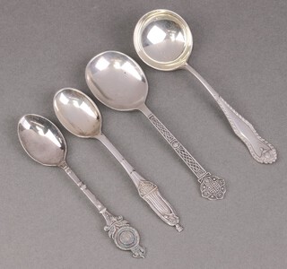 A 1977 Silver Jubilee teaspoon decorated Queen Elizabeth Sheffield 1977 by Cooper Brothers, silver sauce ladle Chester 1918, a Gothic silver spoon Sheffield 1975 and a silver spoon decorated the RAC club badge, 94g