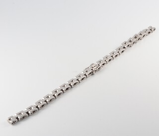 A white gold marked 18k, watch strap bracelet, 14cm, 18.3g