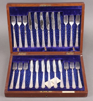 A set of 12 silver plated fruit knives and forks, monogrammed H, contained in a mahogany box  