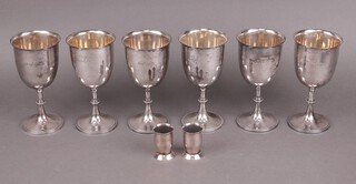 A set of 6 Britannia metal goblets marked Trafalgar and 2 silver plated spirit measures 