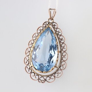 A gold testing as 9ct pierced gold and blue stone set pendant, 4.5cm l