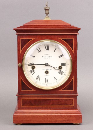 Sewills of Liverpool, a chiming bracket clock with 14cm circular dial, the back plate marked Sewills, contained in a inlaid mahogany case 30cm h x 20cm w x 12cm d 