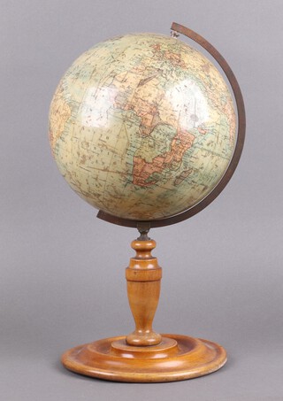 A Philips 9" educational terrestrial globe, raised on a turned beech stand 