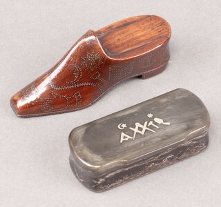 A 19th century Masonic rectangular carved horn snuff box, the lid decorated square, compass and gavel 4cm x 9cm x 4cm and a Victorian inlaid wooden snuff box in the form of a shoe decorated, square, compasses, crossed keys, coffin, anchor and plumb roll 5cm x 10cm 