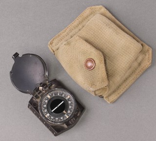 A Second World War German Wehrmacht marching compass (missing mirror to interior), contained in a webbing pouch 