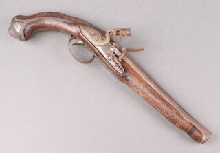 An 18th/19th Century Continental flintlock pistol, the 20cm steel barrel with proof marks, the grip inlaid silver wire