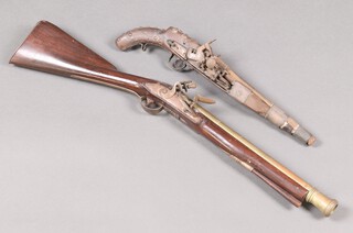 A reproduction blunderbuss with 40cm barrel together with a Continental reproduction flintlock pistol with 30cm barrel 