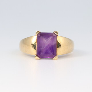 A 9ct gold ring set an amethyst coloured stone, size K 1/2, 3.3g