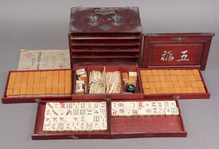 A bone and bamboo Mahjong set in a hardwood carrying case 