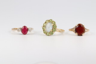 Three 9ct gold past set dress rings, size L, 5.7g gross