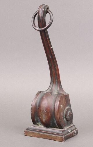 W Tonkin & Sons, a Victorian bronze door stop in the form of a scroll, raised on a square base 30cm h x 10cm w x 7cm d 