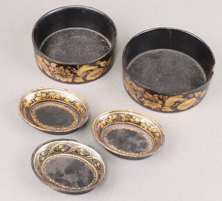 A pair of Regency black and gilt lacquered bottle coasters 13cm diam. (1 with chip), a pair of oval dishes 10cm x 8cm (1 f and r), and 1 other (chips to edge) 