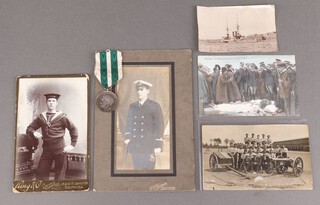 The Messina Earthquake commemorative medal 1908 to F Terrill, Able Bodied HMS Exmouth 1908-1909, privately engraved, together with a black and white photograph of a gun crew, reverse marked Lieutenant Frank Terill in centre front row, a postcard of the earthquake and 2 other photographs 