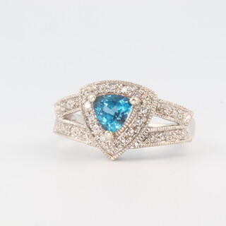 A 9ct white gold topaz and diamond cluster ring of triangular form, size M 1/2, 4.5g 