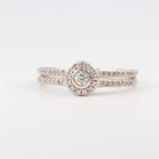 A 9ct white gold diamond set cluster ring, the shoulders each set 2 rows of diamonds, size N, 2.5g