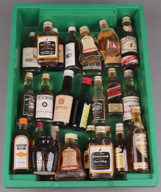 A collection of miniature bottles of malt and other whisky including Larkwood, Islay of Jura single malt, Old Bushmills, etc, some with spirit loss 