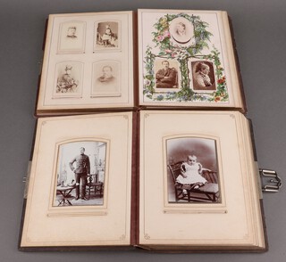 A Victorian leather bound photograph album containing approx. 90 portrait photographs, together with 1 other containing 19 photographs 