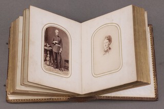 A Victorian leather bound photograph album containing 39 portrait photographs 
