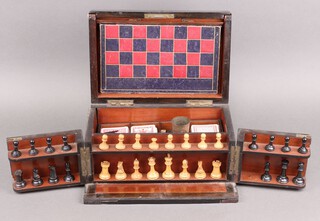 A Victorian games compendium comprising Thornton chess set (black pieces - crown to king missing,  bishop chipped, 1 pawn damaged to base 1 castle missing, white pieces - 1 pawn is missing top), together with 3 associated sets of playing cards (all complete), a double sided chess, backgammon and Monopoly board (split to middle), contained in a coromandel case 