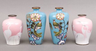 A pair of turquoise floral patterned Japanese cloisonne enamelled vases decorated birds 16cm (both a/f) and a pair of pink ground ditto decorated cranes 12cm 