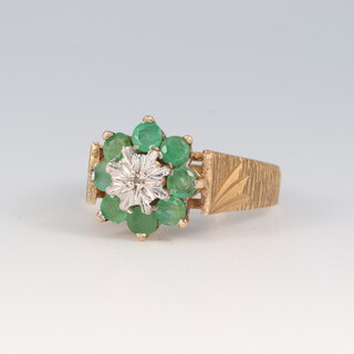 A 9ct barked gold and paste set cluster ring, size N 1/2, 3.9g