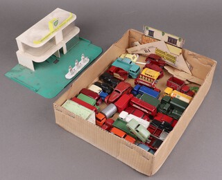 Matchbox by Lesney, a collection of loose and play worn commercial, military and domestic model vehicles, together with a play worn, part complete Matchbox service station 