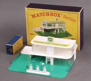 A Matchbox MG1 service station boxed, in very good condition, together with a Matchbox A1 accessory pack BP garage pumps and signs 