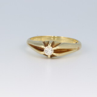 A gold testing as 14ct diamond set gypsy ring, size O, 4.2g