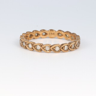 A gold marked 9ct paste set eternity ring size R, 2.2g
