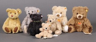 A collection of 7 Steiff teddy bears to include 660177 William and 662713 Katherine, a  669712 mohair Ultimate Bear, 662546 black alpaca, 111372  Flynn Teddy Bear, 65476 Steiff British Collectors Bear 2000 and 660696 Cosy Bear edition 