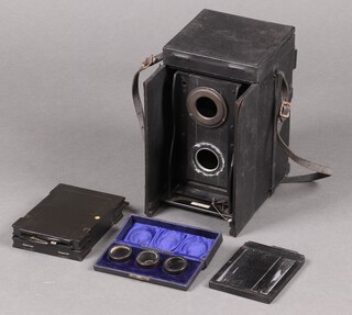 An early 20th century Ross Portable Dividing Twin Lens Camera together with three cased Primus lenses