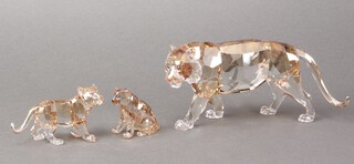 A Swarovski Crystal Endangered Wildlife figure - Tiger 2010 9cm  (with leaflet), together with a standing cub 5cm and a seated cub 5cm, all boxed 