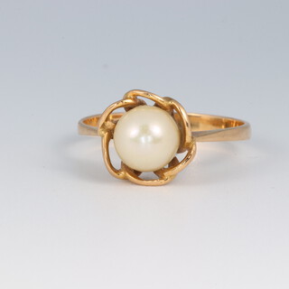 A yellow metal possibly high carat pearl set ring, size Q 1/2, 3.1g