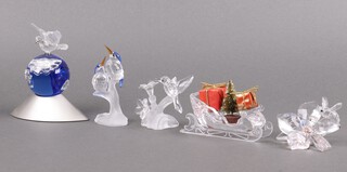 Five Swarovski Crystal figures including Collectors Society figure Jubilee Edition Bee and Flower 2007,  4cm, Humming Bird 6cm, Christmas Sleigh 9cm, Kingfishers 9cm and 2000 Crystal Planet Millennium 11cm, all boxed