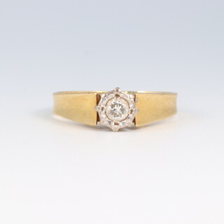 An 18ct gold illusion diamond set ring, size L, 3.6g