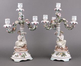A pair of 19th century Continental porcelain 3 light floral encrusted candelabrum, supported by classical ladies, base incised 198 43cm h 