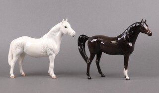 A Beswick figure of a standing Connemara horse 1641 16cm and a ditto Arab Xaral horse 1625 16cm 