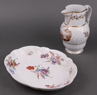 A 19th Century porcelain jug with sparrow beak ribbed body and panelled landscape decoration 19cm, together with a 19th Century porcelain oval plate with floral decoration 28cm 