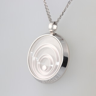 Chopard, from The Happy Spirit Collection, an 18ct white gold necklace with circular pendant set a diamond, approx 0.10ct, signed Chopard to the front and edge of pendant, also marked to the edge "Happy Spirit" and numbered 79/5431-20, together with original certificate of origin and box, length of chain 42cm, pendant 3.2cm diam., gross weight 28g