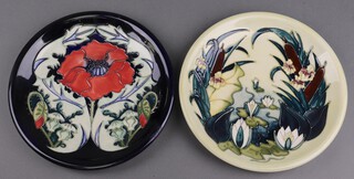 Rachel Bishop for Moorcroft, a Lamia pattern plate 26cm, reverse impressed Moorcroft, Made in England '95, together with Rachel Bishop for Moorcroft poppy pattern plate 26cm, impressed Moorcroft, both boxed 