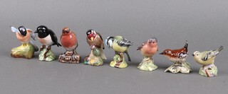 Six Beswick models of birds - Robin 980 (x2), Stone Chat 2274, Blue Tit 992, Goldfinch 2273, Wren 993,  together with a Worcester Goldfinch 3338, a Crown Staffordshire Bull Finch no.6 