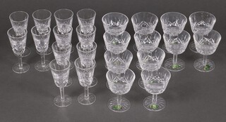 A suite of 24 Waterford Lismore pattern glasses comprising 12 cocktail glasses and 12 sherry/liqueur glasses 