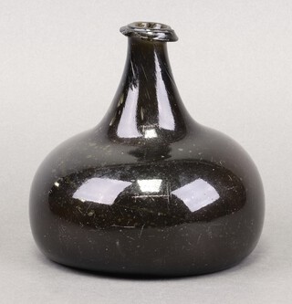 An 18th century green glass wine bottle of onion form 14cm