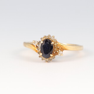 A 9ct gold sapphire and diamond cluster ring, size L, 1.8g
