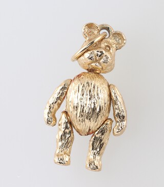 A 9ct gold pendant/charm in the form of an articulated bear, 6.7g