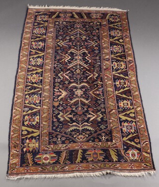 A blue and green ground Caucasian style floral patterned rug within 3 row border 201cm x 116cm 
