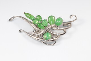 A white gold marked 18K brooch set jade coloured stones 7.8g
