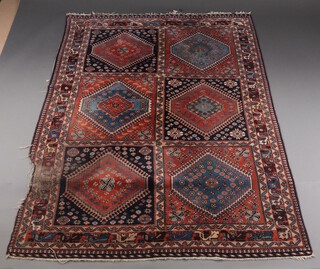 A brown, turquoise and blue ground Persian Yalamech rug formed of 6 rectangular panels with stylised medallions within 252cm x 163cm 