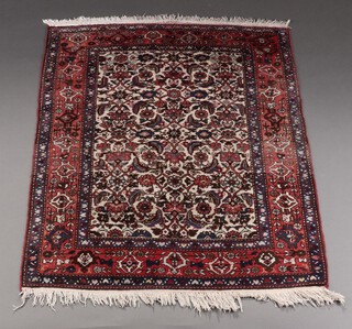 A red, white and blue ground Persian rug with floral decoration within multi row border 149cm x 114cm  